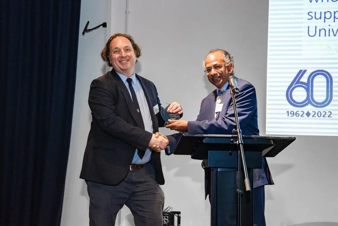 Alumnus Ian Blackmore receiving his award from Professor Rama Thirunamachandran